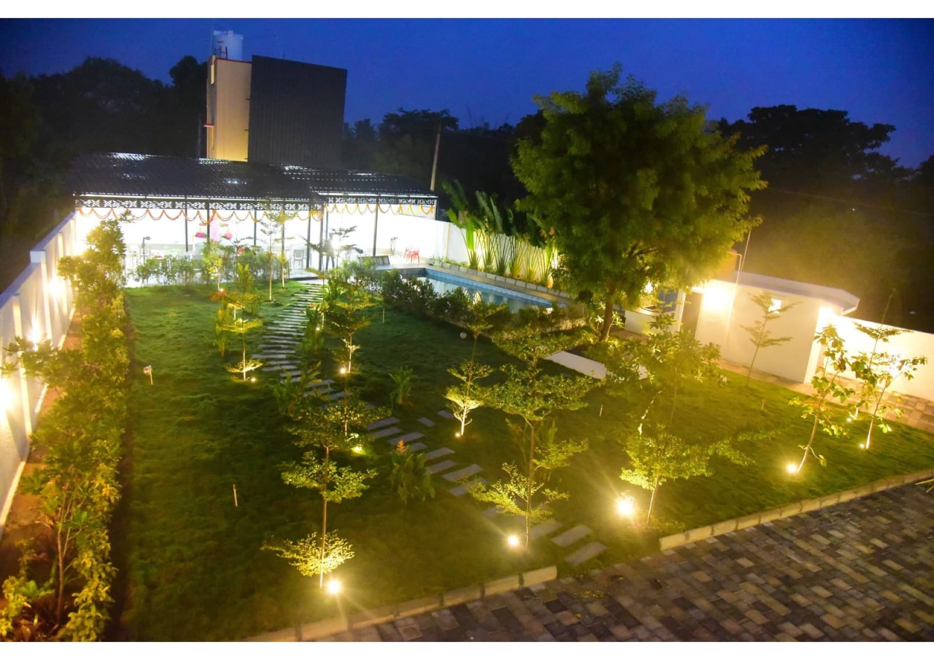 Floodlit lawns and gardens at night