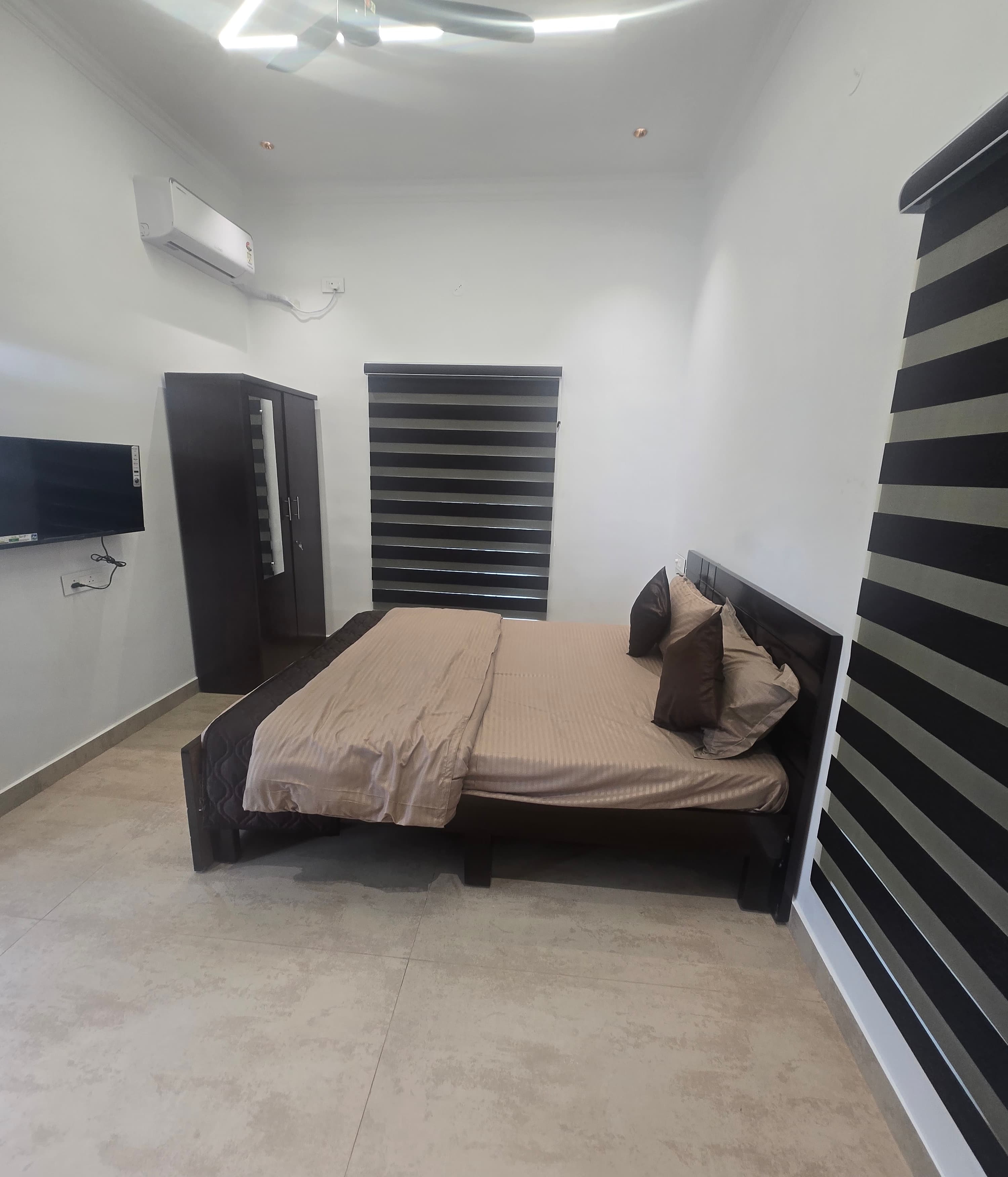 Ensuite bedroom with king bed and AC